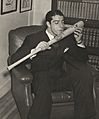 Joe DiMaggio salutes his bat