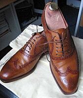 Pair of full brogue shoes by Santoni