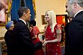 President Barack Obama greets Michaele and Tareq Salahi