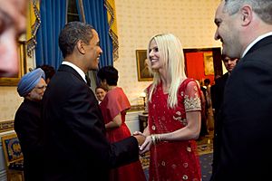 President Barack Obama greets Michaele and Tareq Salahi