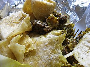 Roti wrap made with curry goat and potatoes 01