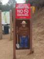 Smokey Bear sign at Mulholland entrance to Runyon Canyon Park, Los Angeles, California, USA