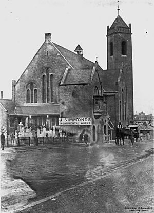 StateLibQld 1 110504 St Andrew's Presbyterian Church on Ann Street, Brisbane, with stonemason next door, ca. 1915