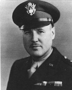 Head and shoulders of a man in uniform with a peaked cap