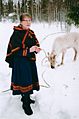 Sami woman with white reindeer