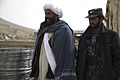 Abdul Samad, left, a recently reintegrated Taliban commander, and Afghan policeman Nic Mohammed, the commander of the Afghan Local Police in Khas Uruzgan, inventory supplies in Khas Uruzgan district, Uruzgan 120304-N-JC271-051