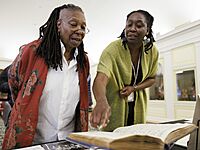 Around the Library of Congress Spring 2024, Whoopi Goldberg looks over a special collections display in the Whittall Pavilion, May 10, 2024 (cropped)