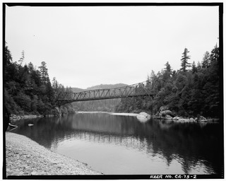 CONTEXTUAL VIEW OF BRIDGE IN SETTING, LOOKING NORTHEAST, FROM UPSTREAM - Smith River Bridge, CA State Highway 199 Spanning Smith River, Crescent City, Del Norte County, CA HAER CAL,8-CRECI.V,1-2