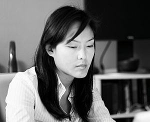 Jane Kim reading, monochrome
