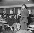 Manzanar Relocation Center, Manzanar, California. Lt. Eugene Bogard explains the purpose of the reg . . . - NARA - 536709