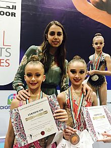 Margarita Mamun with young gymnasts