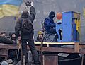 Protester Piano Extremist plays on the roof burned "Berkut" bus. The barricade across Hrushevskoho str. Kiev, 10.02.2014.