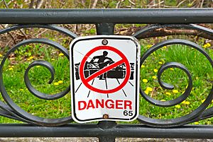 Sign in Niagara Falls, Ontario, warning people not to climb over guard rail