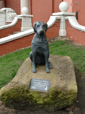Statue to commemorate the foundation of the Guide Dogs for the Blind Association at The Cliff, New Brighton, in 1931
