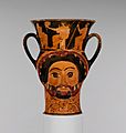 Terracotta kantharos (drinking cup) in the form of the heads of Herakles and of a woman MET DP118168