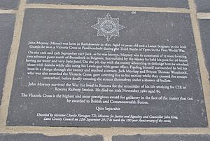 Upper plaque on the memorial to John Moyney, V.C, on Mill Road, Rathdowney, co. Laois