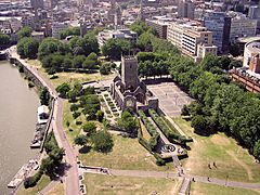 Western part of Castle Park, with ruined St Peter's church in centre and Bristol Bridge just visible in top left. The old city lies beyond.