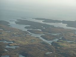 The islands of Eileanan Chearabhaigh at centre, with mainland Benbecula in the foreground and the northern tip of Wiay beyond