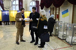 OSCE Parliamentary Assembly Mission Canadian M.P. Mark Warawa and Linda Duncan fill out Observation forms at a Polling Station in Lviv on Ukrainian Parliamentary Election Day