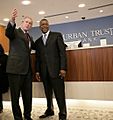 President George W. Bush is welcomed by Bob Johnson, founder and chairman of the RLJ Companies