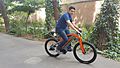A man riding an electric bicycle