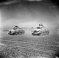 Sherman tanks of the Eighth Army move across the desert