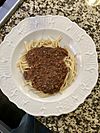 spaghetti topped with chili
