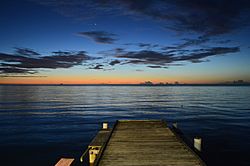 Twilight evening view into the sea (Mona Passage) and the horizing from the shore at Joyuda, Puerto Rico,