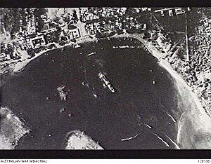 1943-02-18 AERIAL VIEW OF A JAPANESE TRANSPORT SHIP IN THE HARBOUR OF DILI
