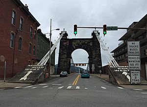2017-07-23 12 04 25 View west along West Virginia State Route 251 (Wheeling Suspension Bridge) at West Virginia State Route 2 (Main Street) in Wheeling, Ohio County, West Virginia