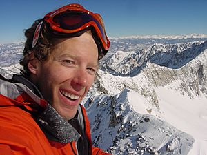 Aron Ralston standing in the snow on the top of Capitol Peak