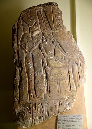 Fragment of a stela showing Amun enthroned. Mut, wearing the double crown, stands behind him. Both are being offered by Ramesses I, now lost. From Egypt. The Petrie Museum of Egyptian Archaeology, London
