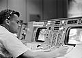 Roger B. Chaffee at a console in the Mission Control Center, Houston, during the Gemini-Titan 3 flight