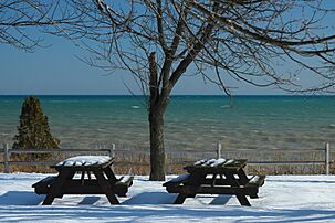 Snowy picnic tables in Alaska Wisconsin