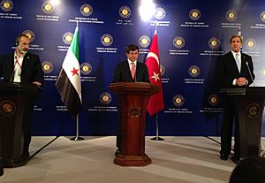 U.S. Secretary of State John Kerry delivers remarks with Turkish Foreign Minister Ahmet Davutoglu and Syrian Opposition Council Chairman Moaz al-Khatib in Istanbul, Turkey on April 20, 2013
