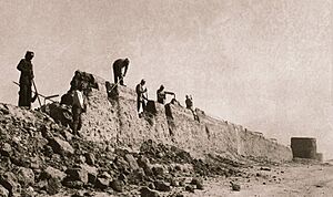 Workers breaking old city walls of Riyadh