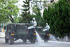 Taiwanese 33rd Chemical Corps spraying disinfectant on a street in Taipei