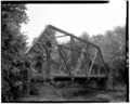 3-4 VIEW, LOOKING SOUTHEAST, SHOWING WEST ELEVATION AND SETTING (SCALE ROD IS MEASURED IN FEET) - Cypress Creek Bridge, Spanning Cypress Creek at County Road 64, Perry, Perry HAER ARK,53-PER.V,1-4