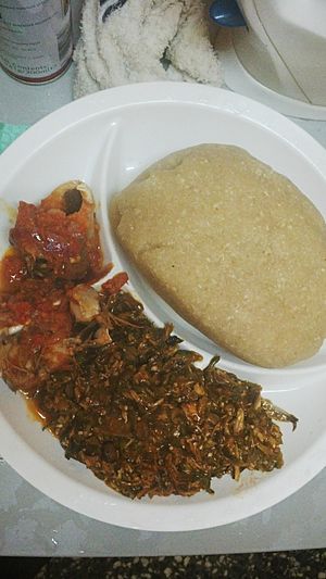 Eba and Efo riro (Vegetable Soup) with Fish