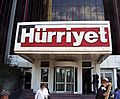 Entrance to an office building with an overhead sign saying 'Hürriyet'