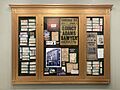 Lobby display at the Somerville Theatre with old photos, tickets, posters, and newspaper clippings related to the theatre