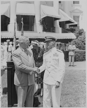 Photograph of President Truman shaking hands with Admiral Marc Mitscher, commander of the 8th Fleet and wartime... - NARA - 199402