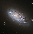 The peculiar asymmetry of NGC 949