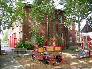 Firehouse Mini Park and the Cherry Hill Community Center: the former Firehouse No. 23, headquarters of the Central Area Motivation Program. The building is on the National Register of Historic Places.