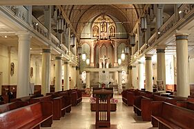 Pews, ambo, baptismal font, altar, and cathedra in c. 2014