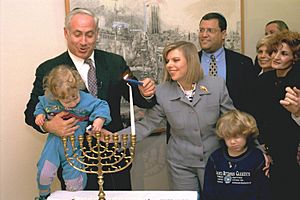 Flickr - Government Press Office (GPO) - P.M. BENJAMIN NETANYAHU LIGHTING HANUKA CANDLES WITH HIS WIFE AND SONS