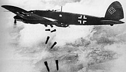 Heinkel He 111H dropping bombs 1940.jpg