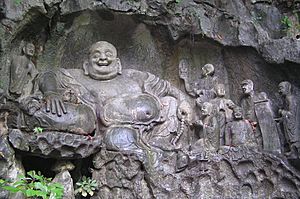 Maitreya and discilples carving in Feilai Feng Caves