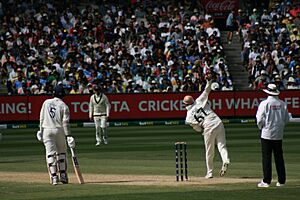 Nathan Lyon bowling in the 4th Test Match of the 2024–25 Border–Gavaskar Trophy.