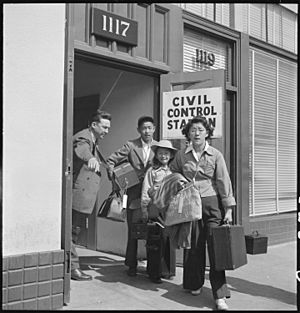 Oakland, California. Part of family unit of Japanese ancestry leave Wartime Civil Control Administr . . . - NARA - 537706